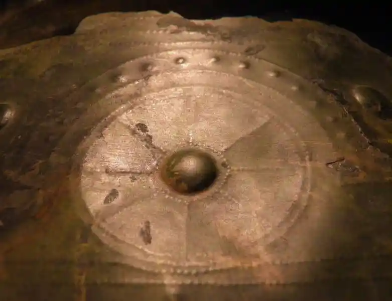 Metal sheet with solar disc symbol